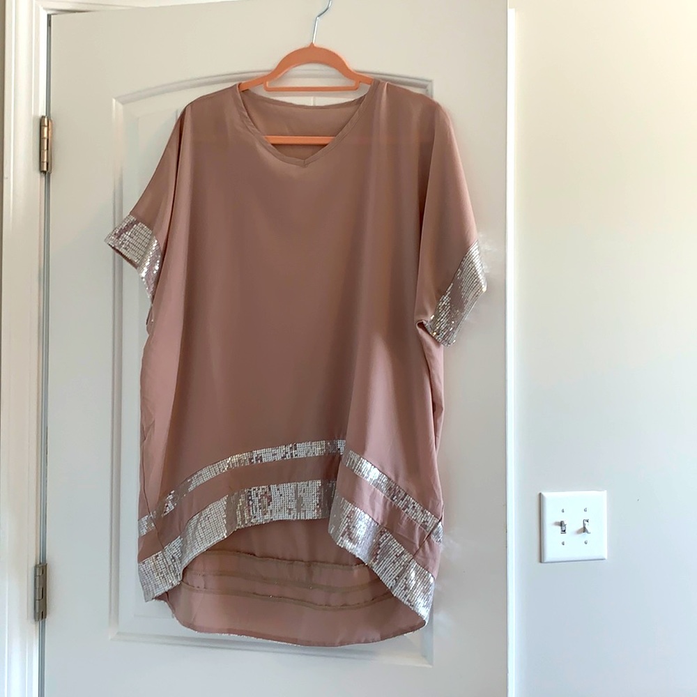Tunic with sequin trim M/L. Never been worn.